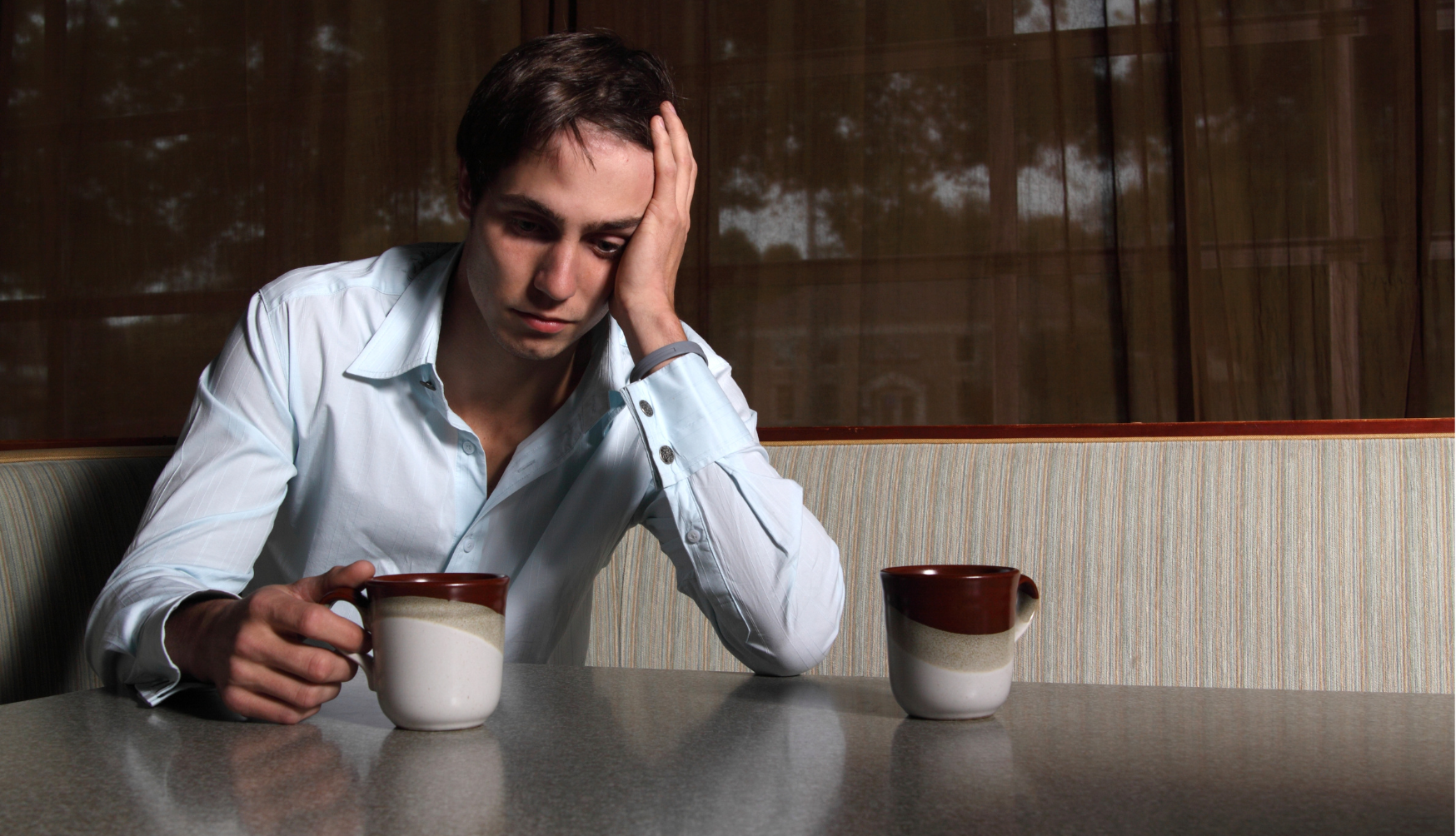 Lonely CFO with coffee – the silent burden of financial responsibility